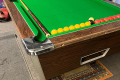 Pool table re-rubbered and recovered.